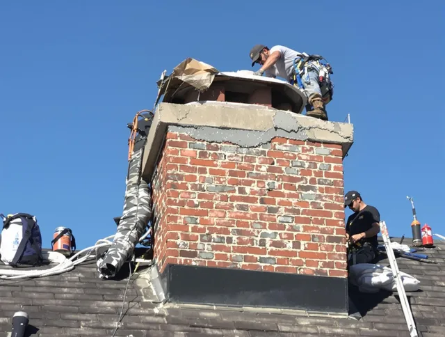 West Covina Chimney Sweep installing a custom chimney crown in West Covina, CA