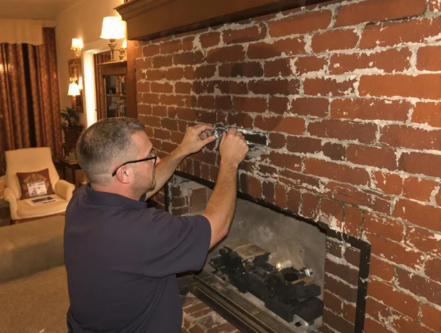 West Covina Chimney Sweep expert fixing a fireplace in West Covina, CA